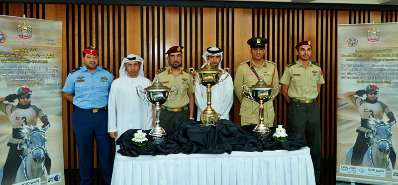 Officials of the CISM World Military Endurance Championship and representatives of IPIC, sponsors for the event, pose in front of the trophies for the competition to be held March 6 at Dubai International Endurance City.